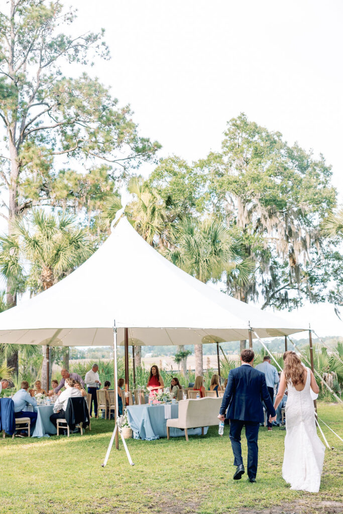 Couple walking to their Intimate Savannah Backyard Wedding