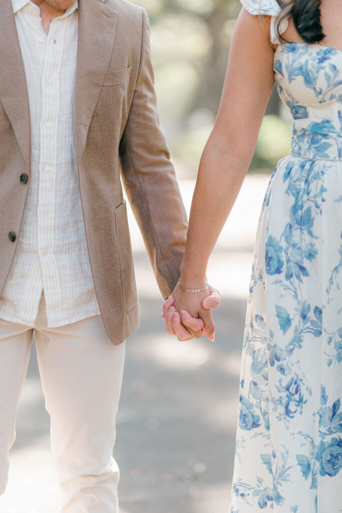 Close-up of an engaged couple holding hands during their Savannah photo session